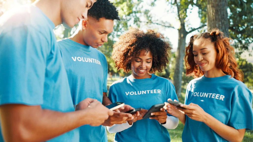 Nonprofit volunteers smiling outside a community event